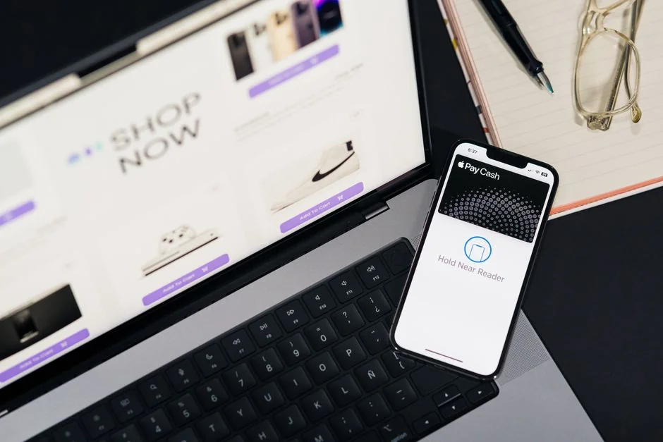 Stylish and efficient workspace with multiple monitors, laptop, and smartphone, showcasing a web design project.